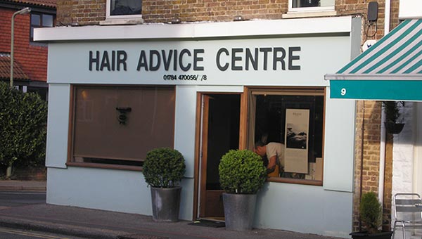 Storefront with signage reading "Hair Advice Centre"